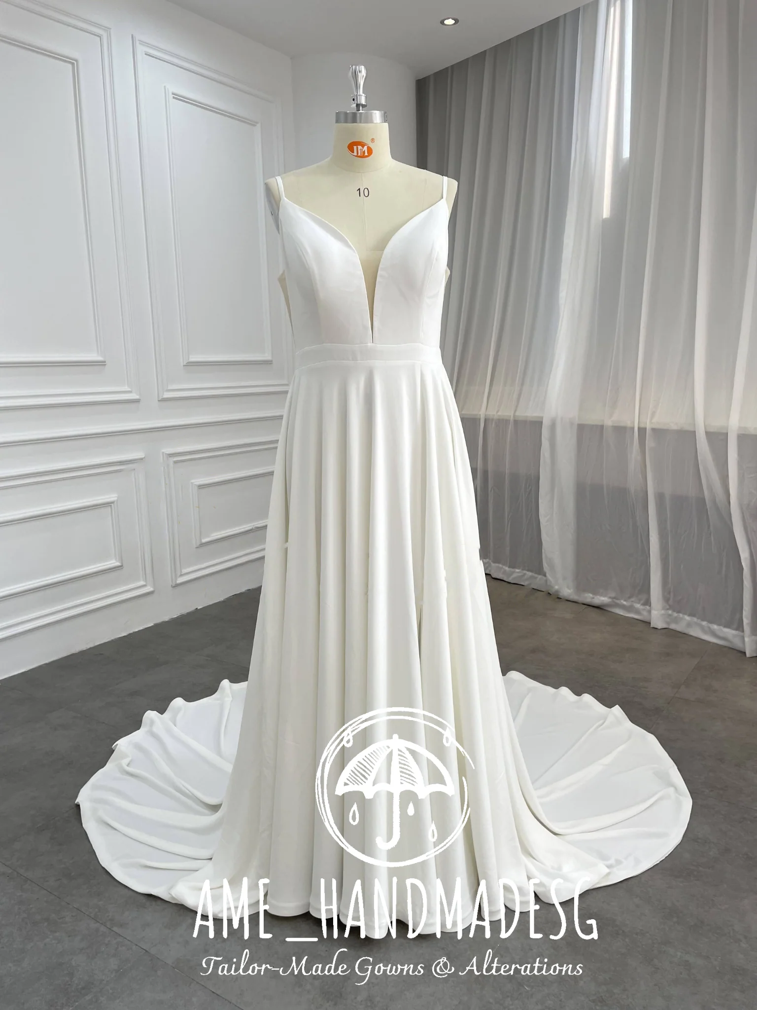 Minimalist A-Line Satin Wedding Gown with Plunging V-Neckline & Flowing Train